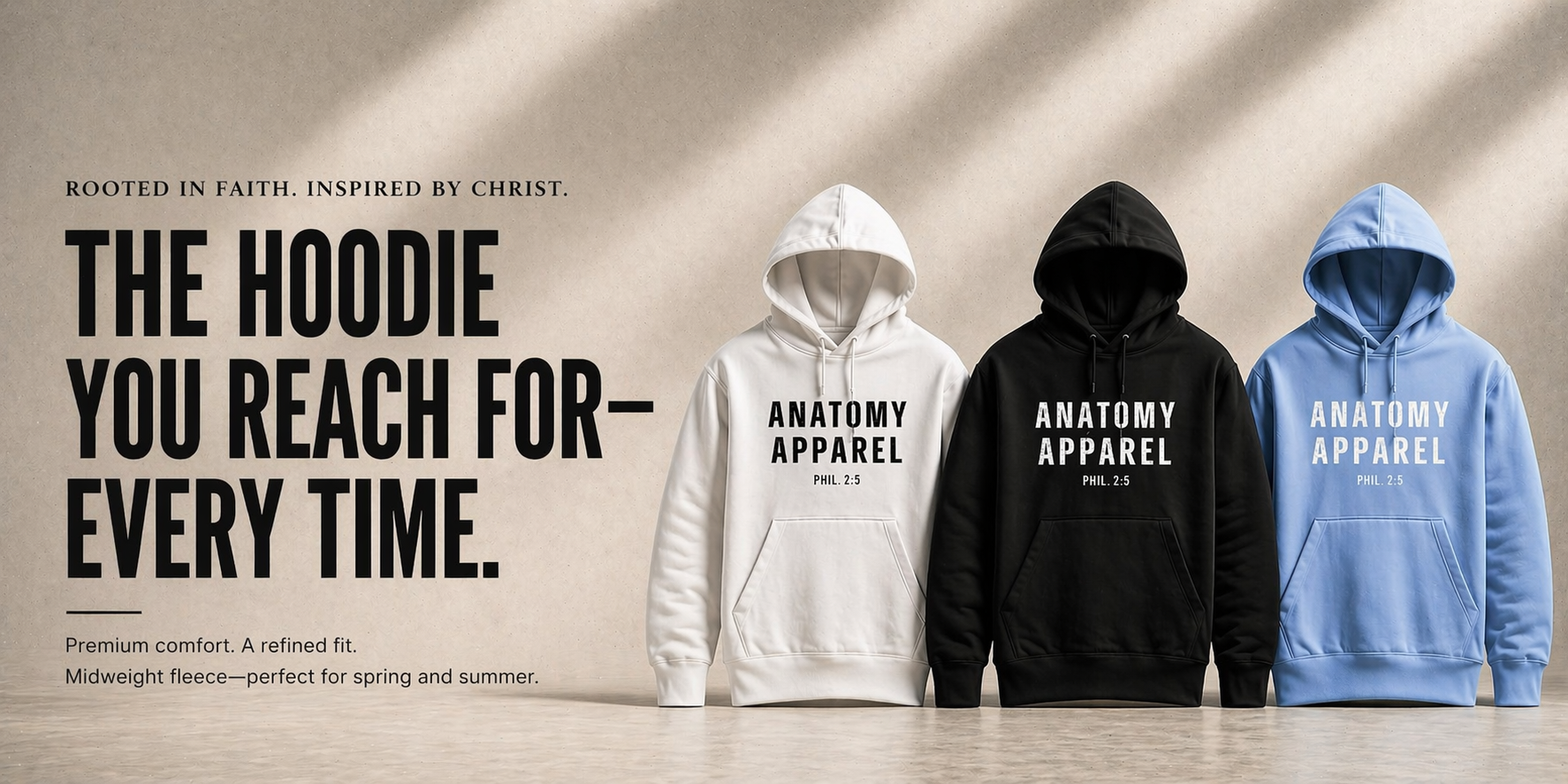 Three hoodies in white, black, and blue with 'Anatomy Apparel' branding on a neutral background.